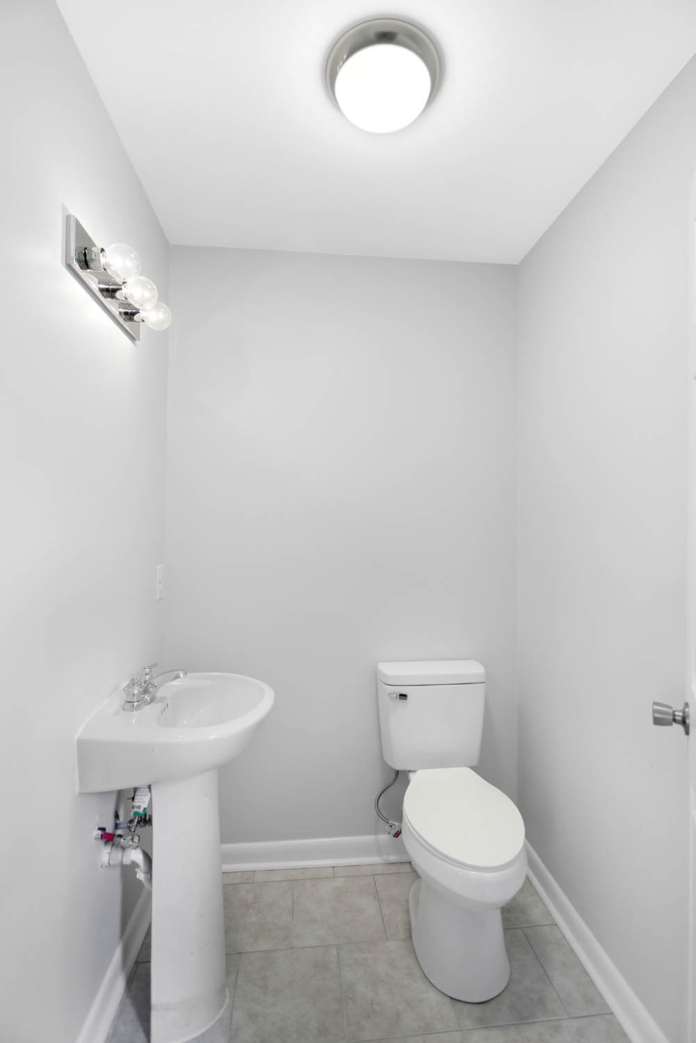 211 General Forrest Drive Springfield, TN 37172 - Photo 14 of 23 a white toilet sitting next to a white sink