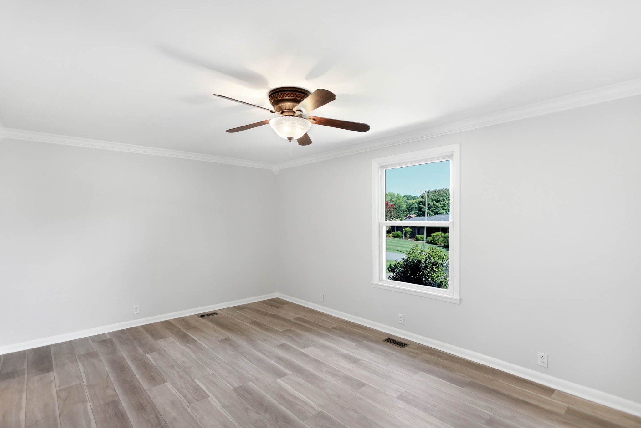 211 General Forrest Drive Springfield, TN 37172 - Photo 18 of 23 an empty room with a window and a ceiling fan