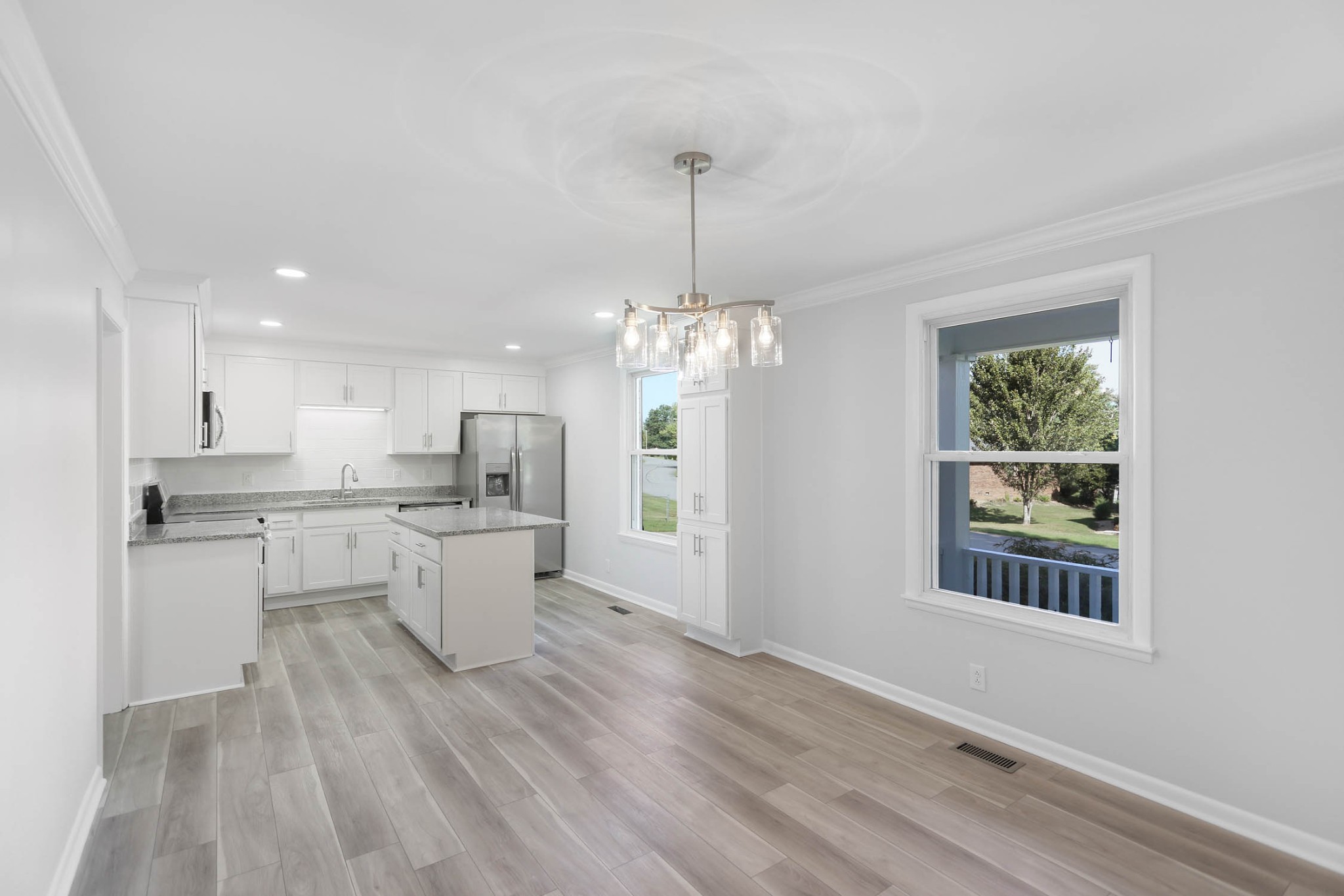 211 General Forrest Drive Springfield, TN 37172 - Photo 2 of 23 a kitchen with kitchen island wooden floors appliances and cabinets