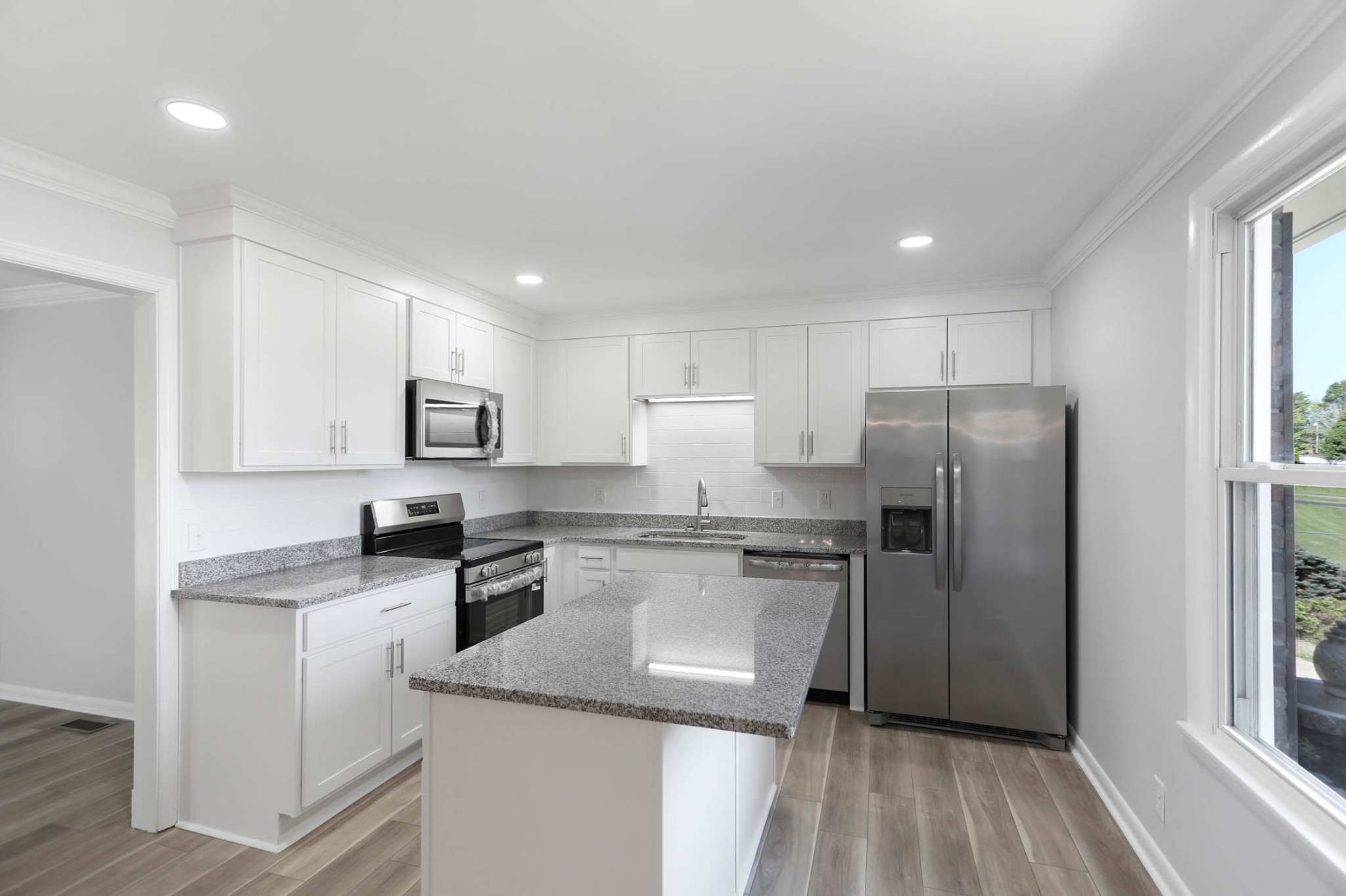 211 General Forrest Drive Springfield, TN 37172 - Photo 5 of 23 a kitchen with a refrigerator a sink a stove a microwave and cabinets