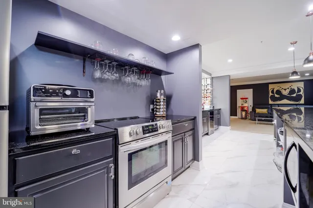 a bathroom with a granite countertop sink toilet a large mirror a vanity and shower