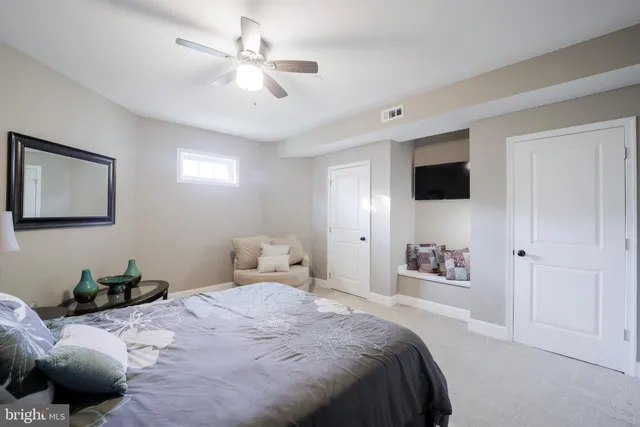 a view of swimming pool with lounge chair under an umbrella
