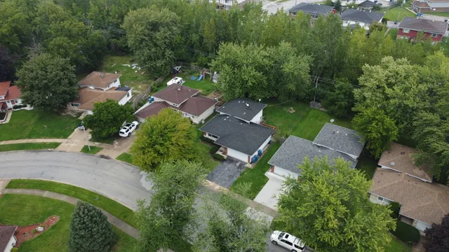 an aerial view of house with yard