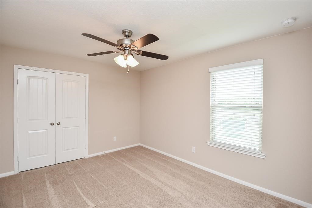 7002 Edwanna Lane Spring, TX 77389 - Photo 14 of 17 a view of an empty room with a window