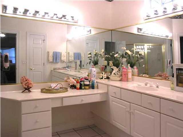 170 Indigo Loop Miramar Beach, FL 32550 - Photo 11 of 15 a room with a sink mirror and cabinets