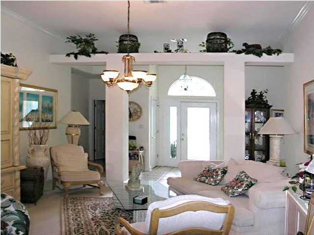 170 Indigo Loop Miramar Beach, FL 32550 - Photo 2 of 15 a living room with furniture and a chandelier