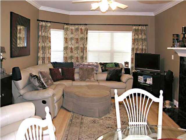 170 Indigo Loop Miramar Beach, FL 32550 - Photo 5 of 15 a living room with furniture a flat screen tv and a large window
