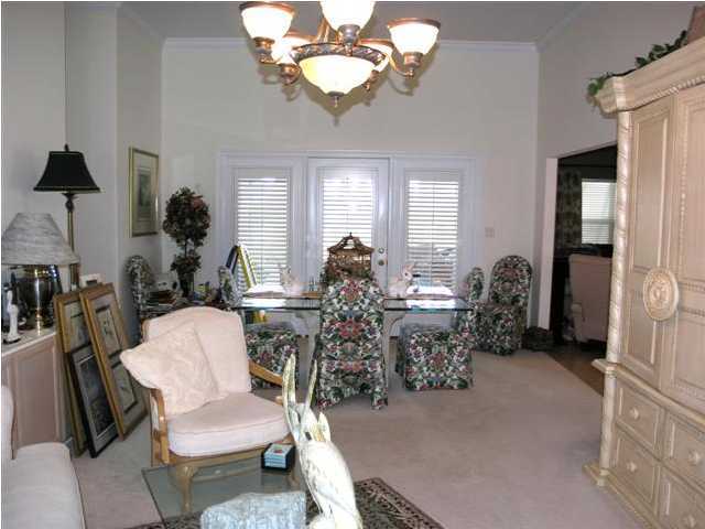 170 Indigo Loop Miramar Beach, FL 32550 - Photo 6 of 15 a living room with fireplace furniture and a chandelier