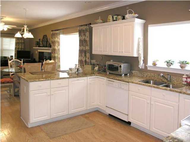 170 Indigo Loop Miramar Beach, FL 32550 - Photo 8 of 15 a kitchen with granite countertop white cabinets white appliances and a sink
