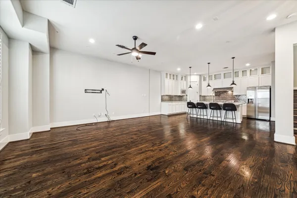 a view of kitchen with furniture and wooden floor