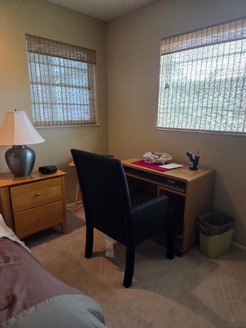 2950 Southeast Ocean Boulevard, Unit 1317 Stuart, FL 34996 - Photo 11 of 19 a dining room with a desk and a window