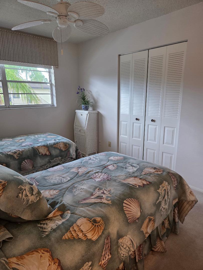 2950 Southeast Ocean Boulevard, Unit 1317 Stuart, FL 34996 - Photo 15 of 19 a bedroom with a bed and a window