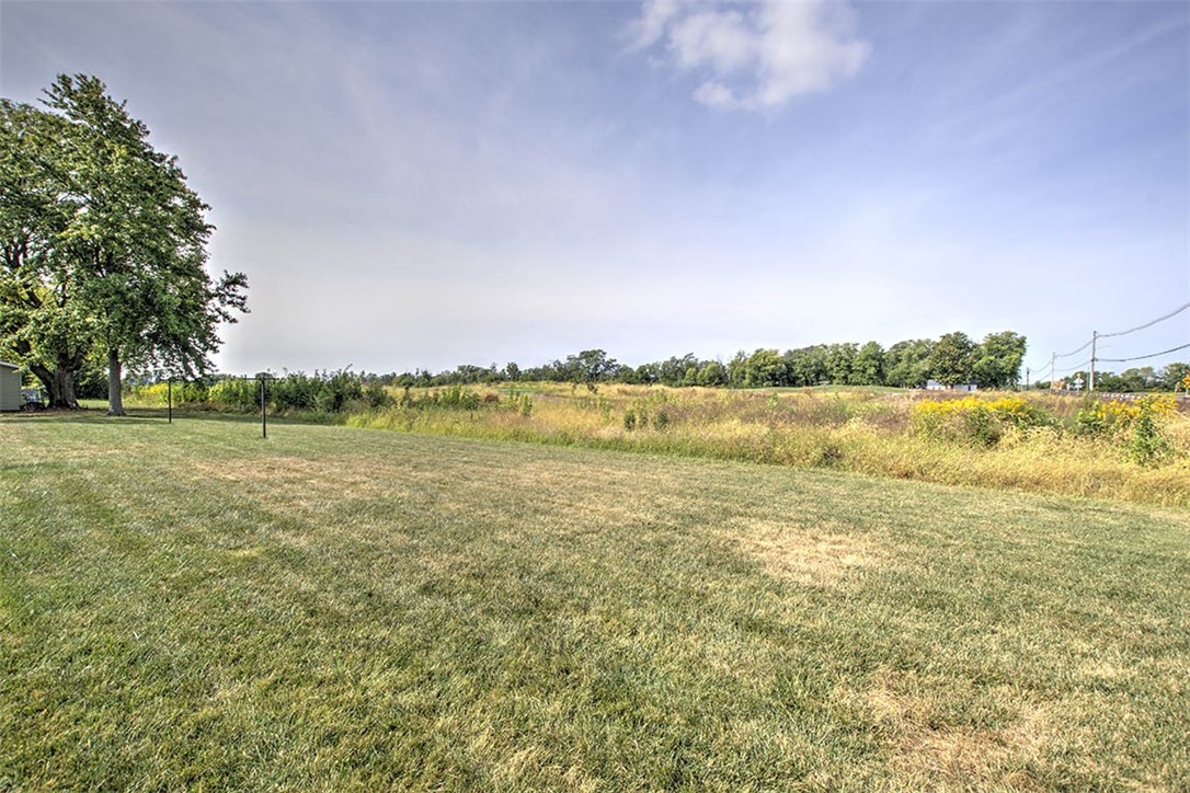 2913 South Danny Drive Decatur, IL 62521 - Photo 27 of 31 a view of a lake with houses in the background