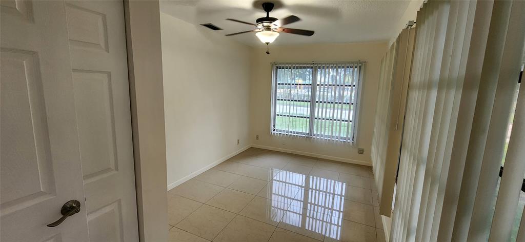 Undisclosed Address Margate, FL 33063 - Photo 21 of 26 a view of an empty room with a window