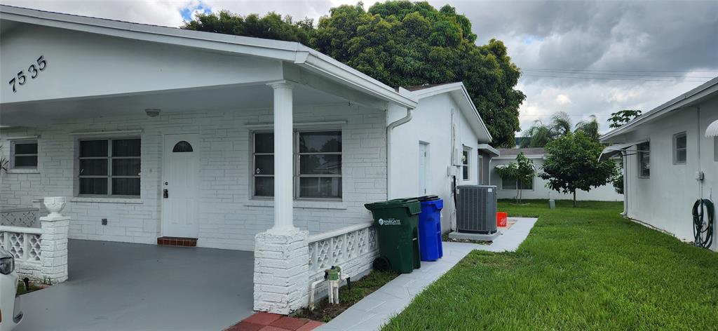Undisclosed Address Margate, FL 33063 - Photo 25 of 26 a front view of house with yard