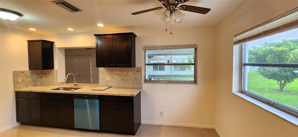 Undisclosed Address Margate, FL 33063 - Photo 5 of 26 a bathroom with a sink and a mirror