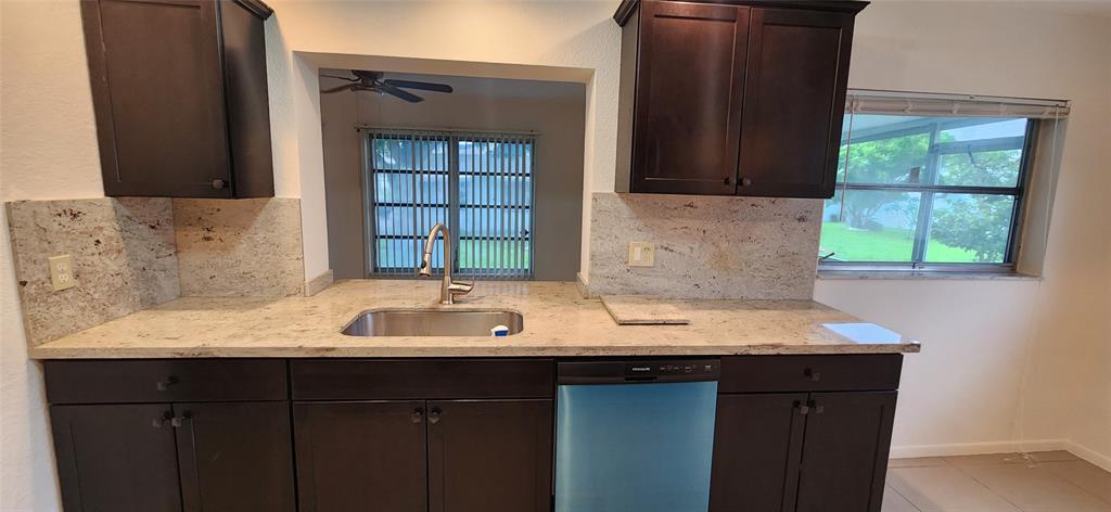 Undisclosed Address Margate, FL 33063 - Photo 6 of 26 a bathroom with a granite countertop sink and a mirror