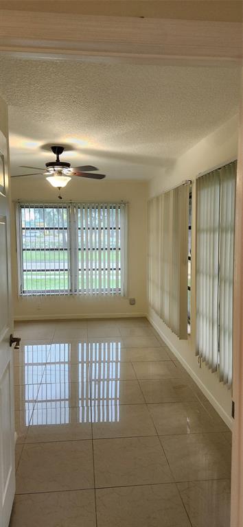 Undisclosed Address Margate, FL 33063 - Photo 8 of 26 a view of an empty room with a window
