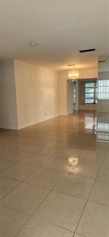 Undisclosed Address Margate, FL 33063 - Photo 9 of 26 a view of a livingroom with an empty space and a window