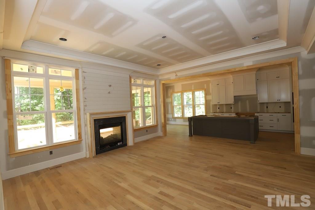 2997 Club Drive Raleigh, NC 27613 - Photo 3 of 30 a living room with furniture and a fireplace