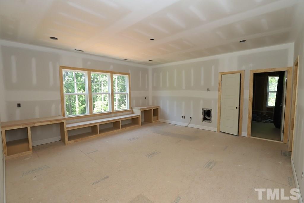 2997 Club Drive Raleigh, NC 27613 - Photo 22 of 30 a view of an empty room with a window