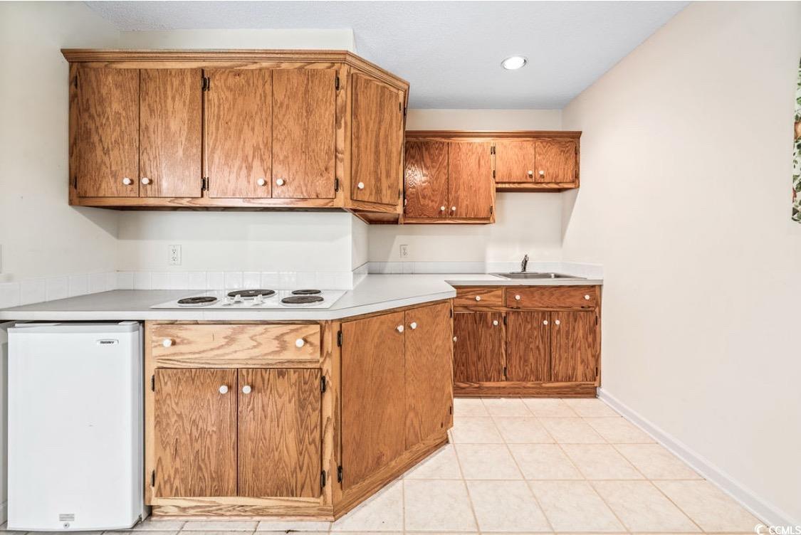 244 George Washington Trail Georgetown, SC 29440 - Photo 23 of 39 Kitchen featuring white electric stovetop, light c