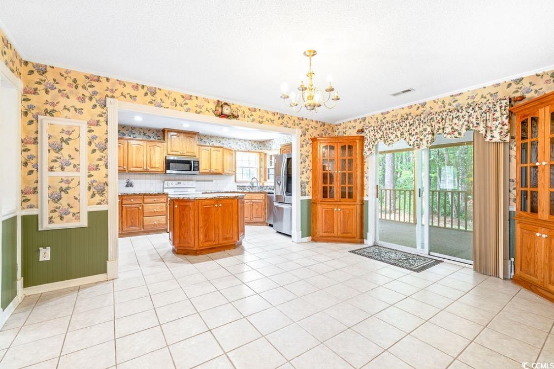 244 George Washington Trail Georgetown, SC 29440 - Photo 3 of 39 Kitchen with stainless steel appliances, wallpaper