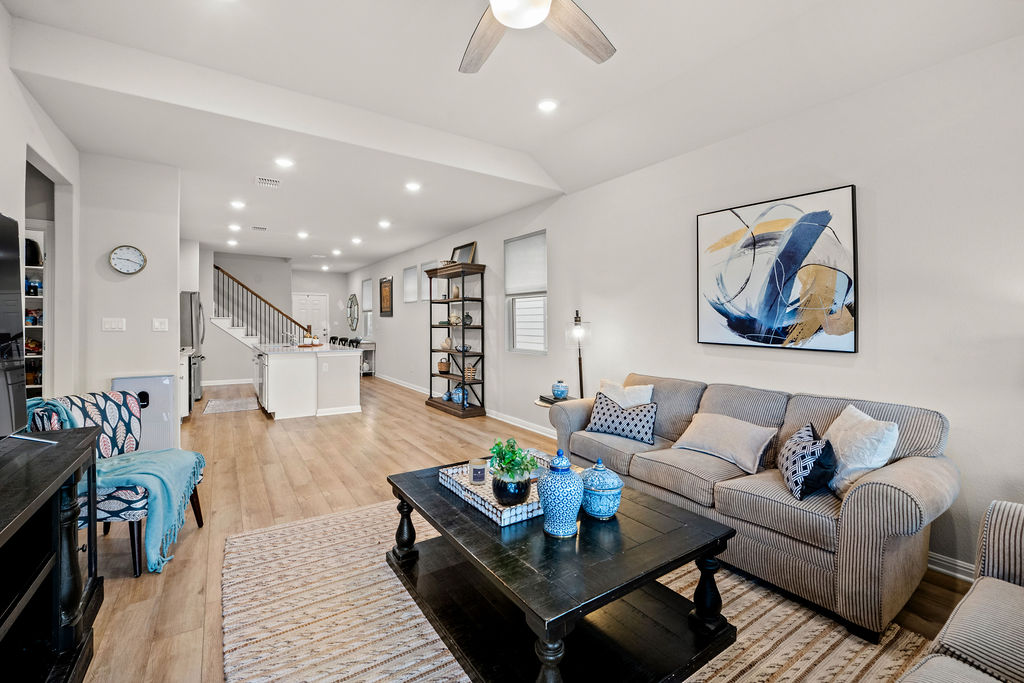 2417 Roosevelt Road Leander, TX 78641 - Photo 4 of 40 Living area featuring light wood-type flooring, recessed lighting, stairs, and ceiling fan