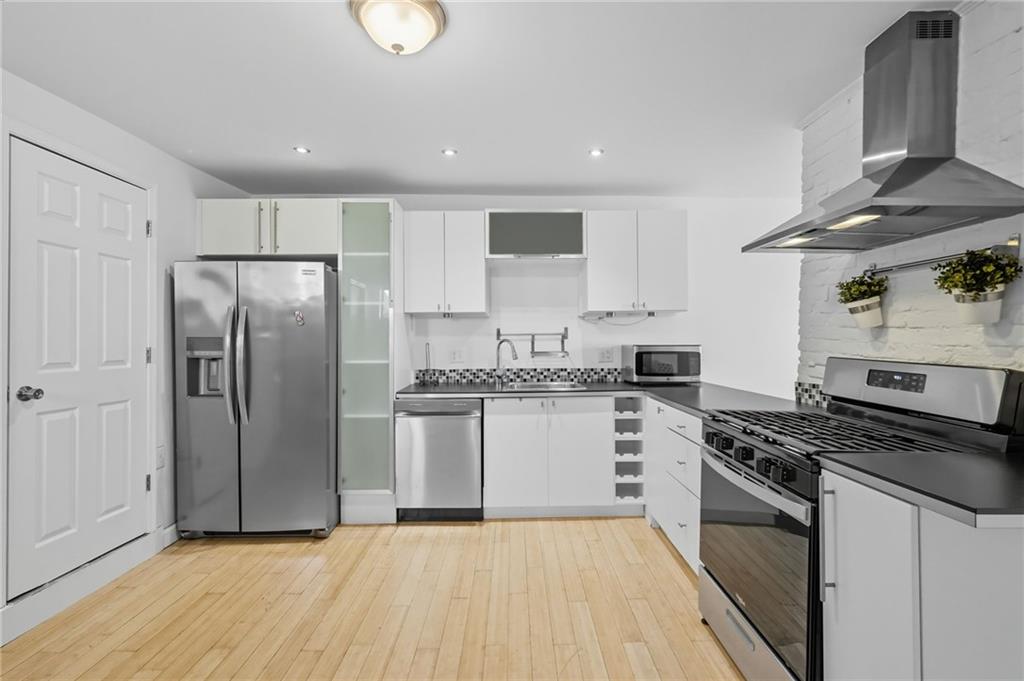 1824 Fox Way Pittsburgh, PA 15203 - Photo 12 of 49 a kitchen with granite countertop a stove a sink and a refrigerator