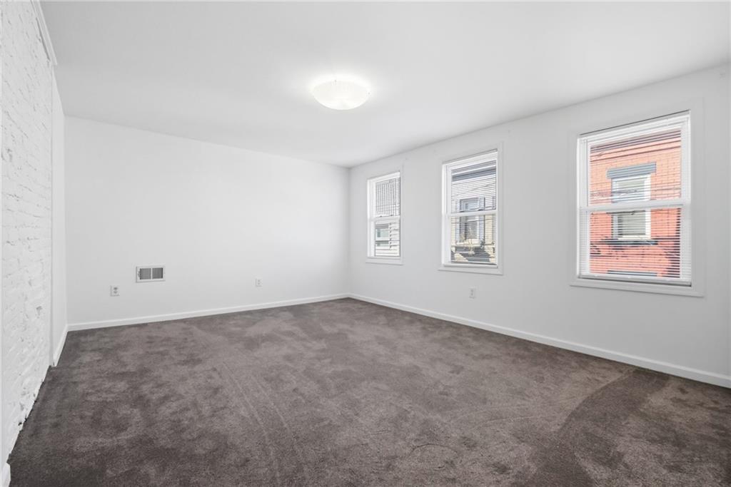 1824 Fox Way Pittsburgh, PA 15203 - Photo 19 of 49 an empty room with windows