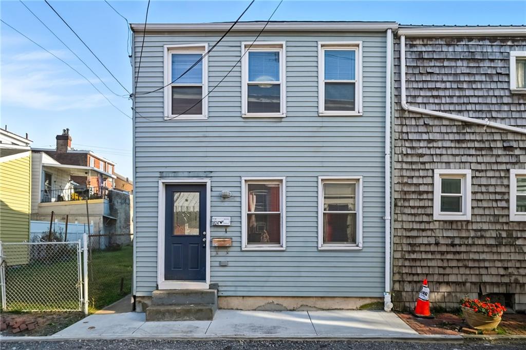 1824 Fox Way Pittsburgh, PA 15203 - Photo 2 of 49 a front view of a house with a garage