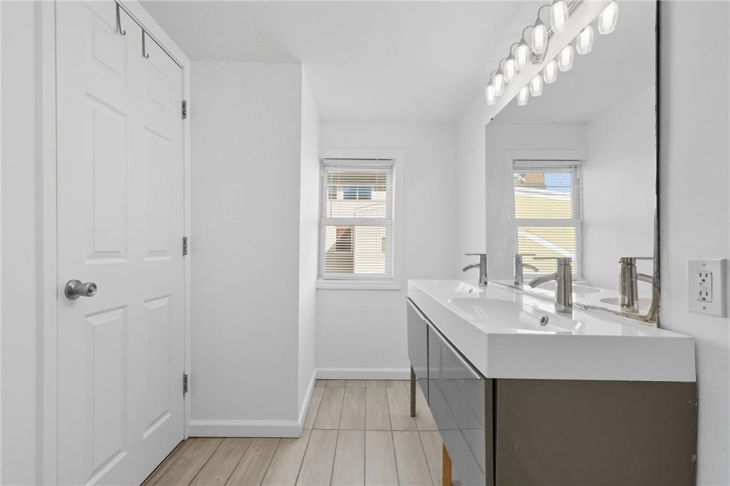 1824 Fox Way Pittsburgh, PA 15203 - Photo 21 of 49 a bathroom with a sink a mirror and a shower