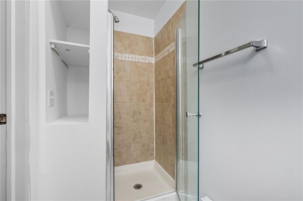 1824 Fox Way Pittsburgh, PA 15203 - Photo 32 of 49 a bathroom with a glass shower door