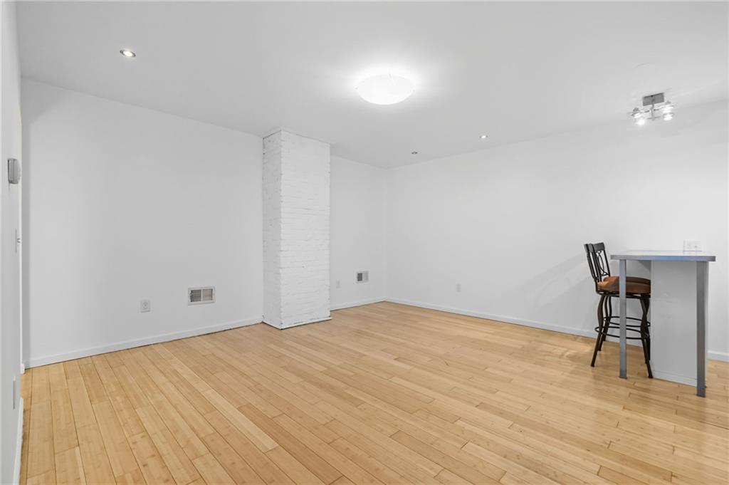 1824 Fox Way Pittsburgh, PA 15203 - Photo 34 of 49 a view of empty room with wooden floor and fan
