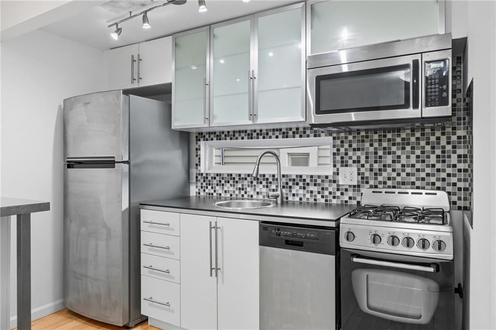 1824 Fox Way Pittsburgh, PA 15203 - Photo 37 of 49 a kitchen with cabinets and steel stainless steel appliances
