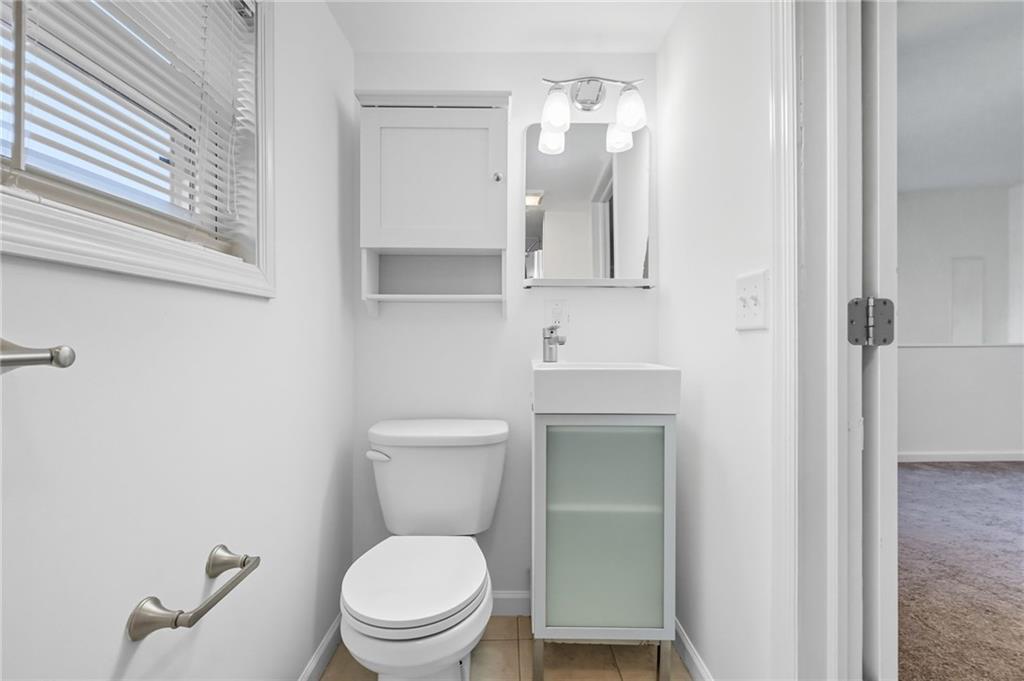 1824 Fox Way Pittsburgh, PA 15203 - Photo 42 of 49 a white toilet sitting next to a bathroom sink
