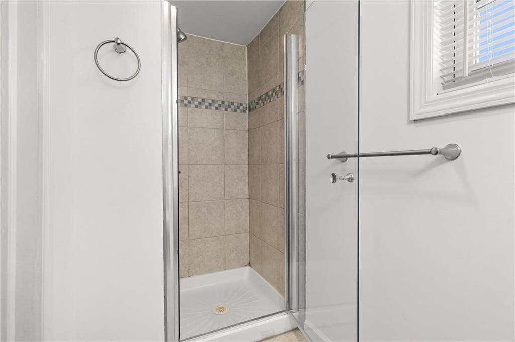 1824 Fox Way Pittsburgh, PA 15203 - Photo 43 of 49 a bathroom with a glass shower door
