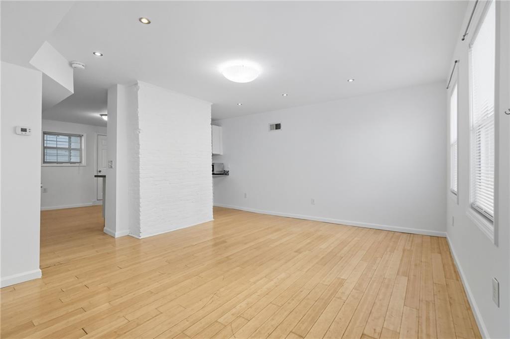 1824 Fox Way Pittsburgh, PA 15203 - Photo 6 of 49 wooden floor in an empty room with a window