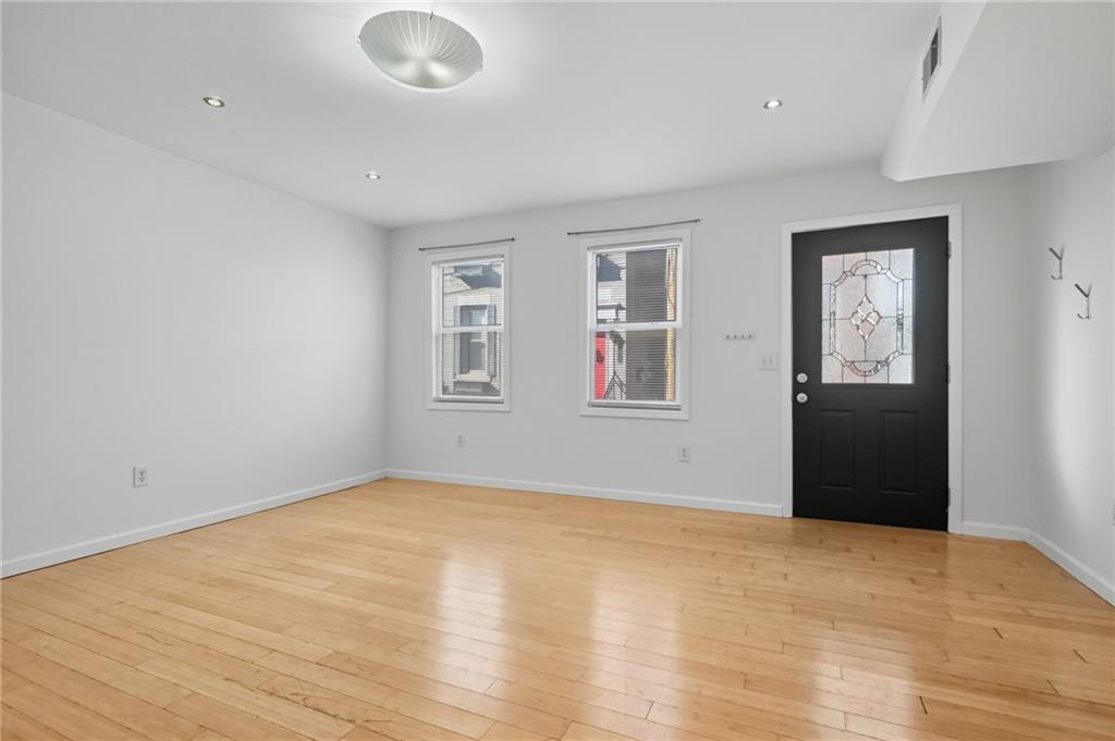 1824 Fox Way Pittsburgh, PA 15203 - Photo 7 of 49 a view of an empty room with window and wooden floor