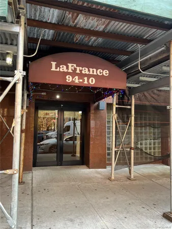 a front view of a building with parking space