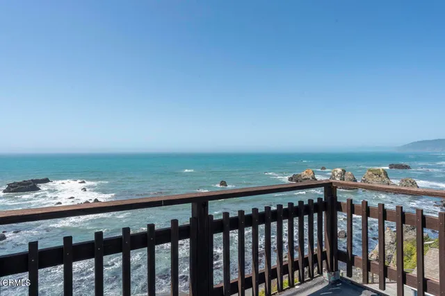 a view of a balcony with an ocean