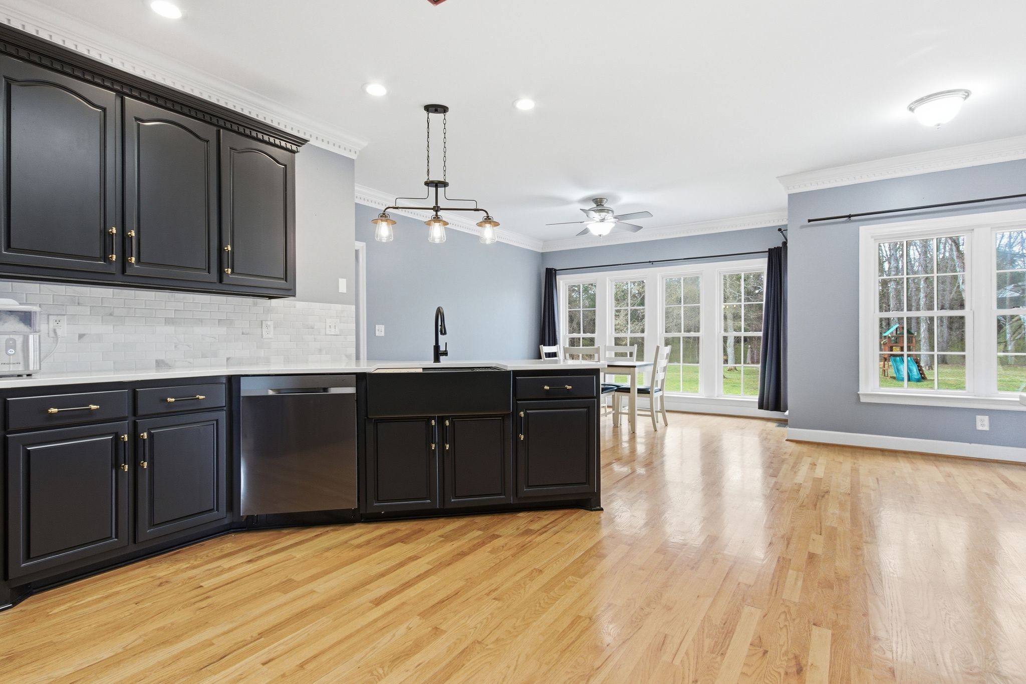 2320 Snake Town Road Chapel Hill, TN 37034 - Photo 19 of 48 a kitchen with stainless steel appliances granite countertop a sink dishwasher a stove and a large window with wooden floor