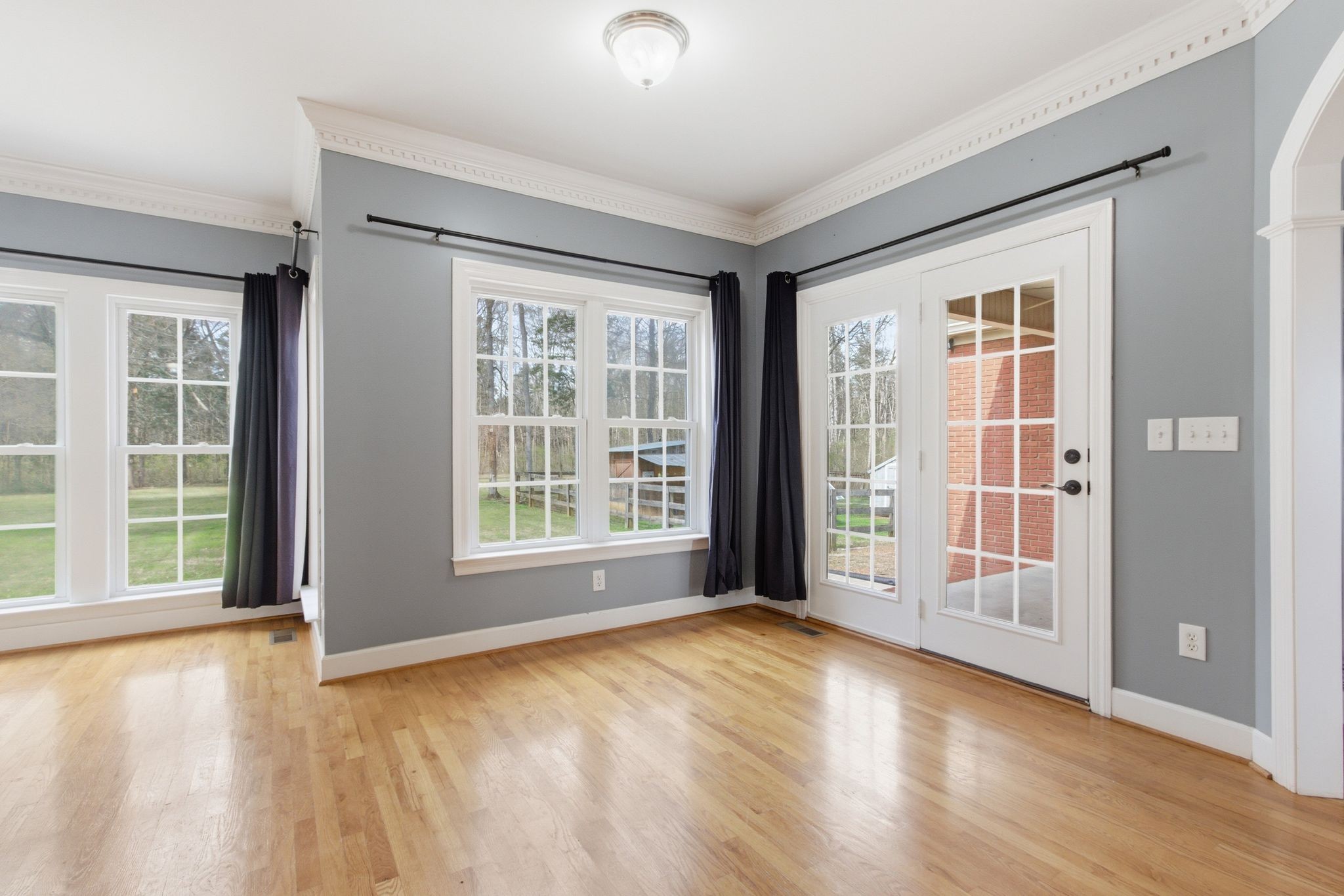 2320 Snake Town Road Chapel Hill, TN 37034 - Photo 23 of 48 an empty room with wooden floor and windows
