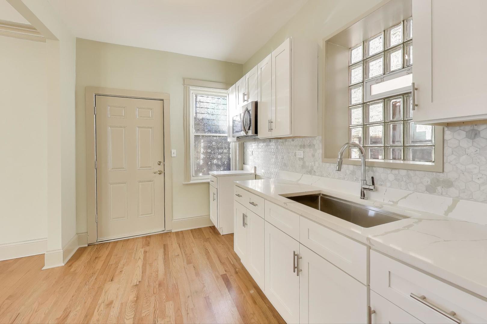 6146 South Evans Avenue, Unit 2 Chicago, IL 60637 - Photo 12 of 20 a kitchen with a sink and cabinets