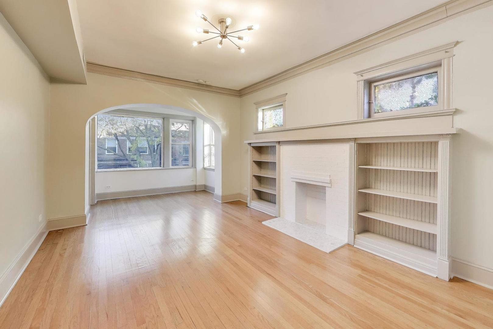 6146 South Evans Avenue, Unit 2 Chicago, IL 60637 - Photo 3 of 20 a view of livingroom with hardwood floor and window