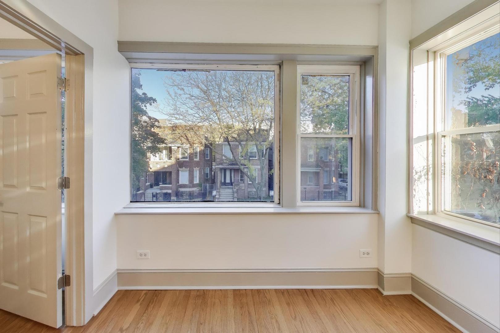 6146 South Evans Avenue, Unit 2 Chicago, IL 60637 - Photo 6 of 20 a view of a room with wooden floor and a window