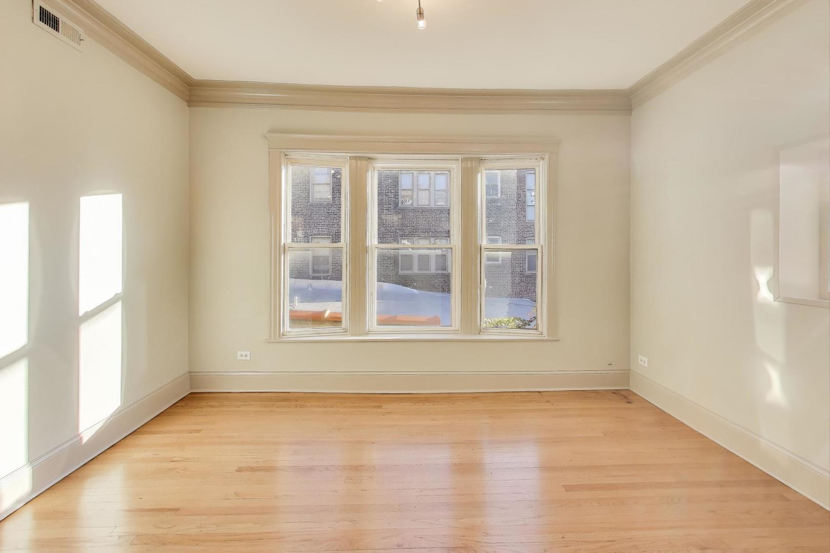 6146 South Evans Avenue, Unit 2 Chicago, IL 60637 - Photo 7 of 20 a view of an empty room with a window