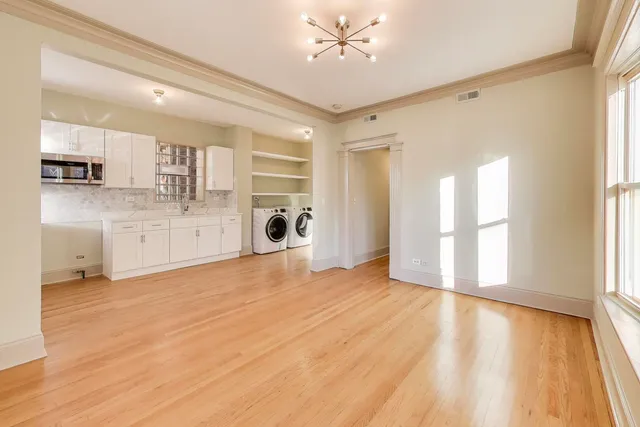 a view of a kitchen with a sink and a window