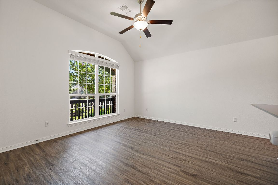 2021 Long Shadow Lane Georgetown, TX 78628 - Photo 16 of 36 wooden floor in an empty room with a window