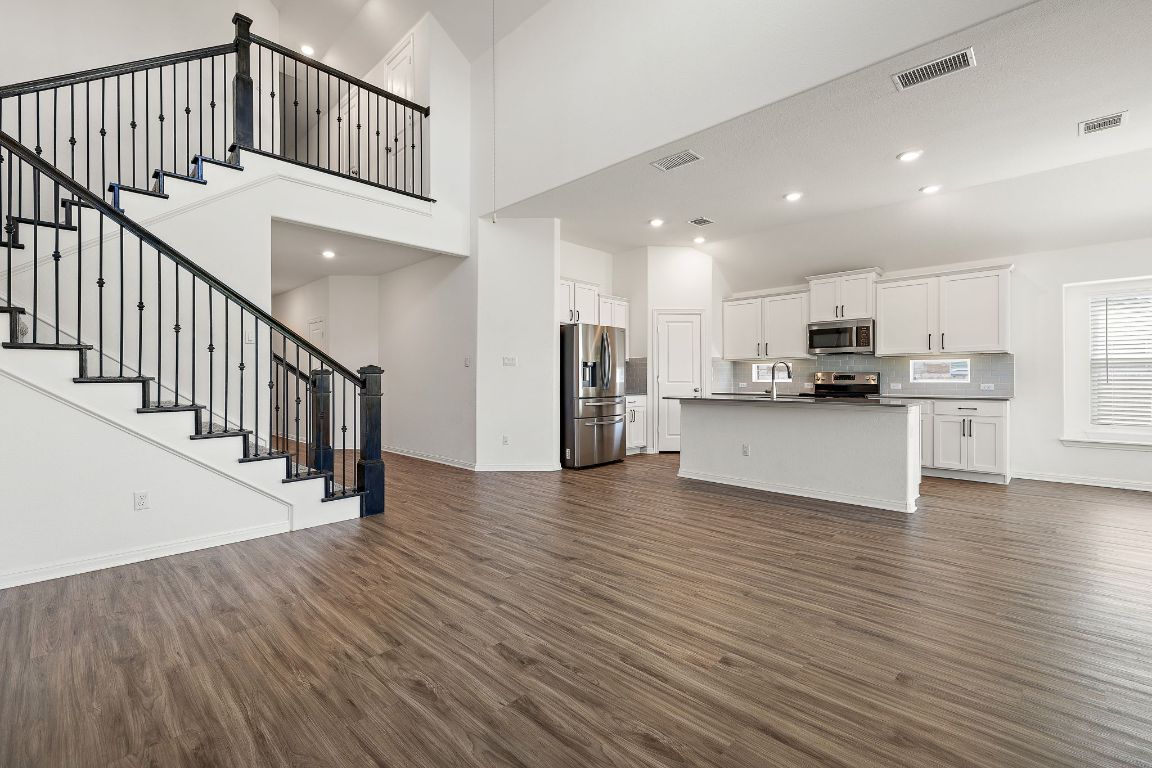 2021 Long Shadow Lane Georgetown, TX 78628 - Photo 5 of 36 a view of kitchen with cabinets and wooden floor